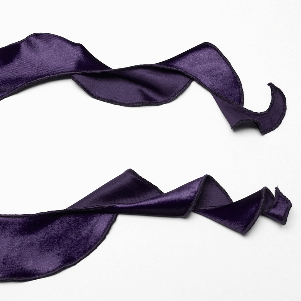 Asymmetric ruffled hem detail of gothic velvet top showing curved draped edge and soft velvet pile