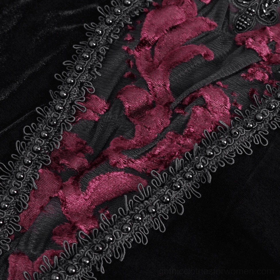 Detailed view of burgundy floral embroidery with beaded cord trim on gothic velvet garment