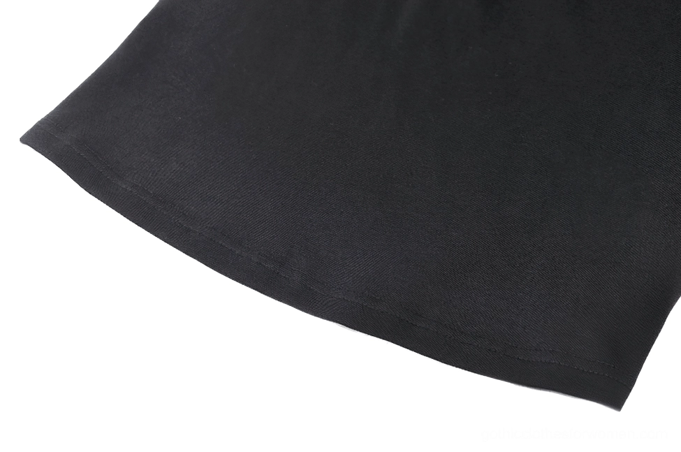 Black smooth knit cotton fabric texture and weave detail of gothic long sleeve top