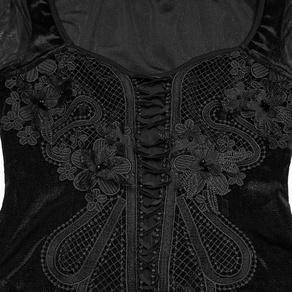 Close-up detail of front floral embroidery and grid mesh fabric pattern on black gothic top