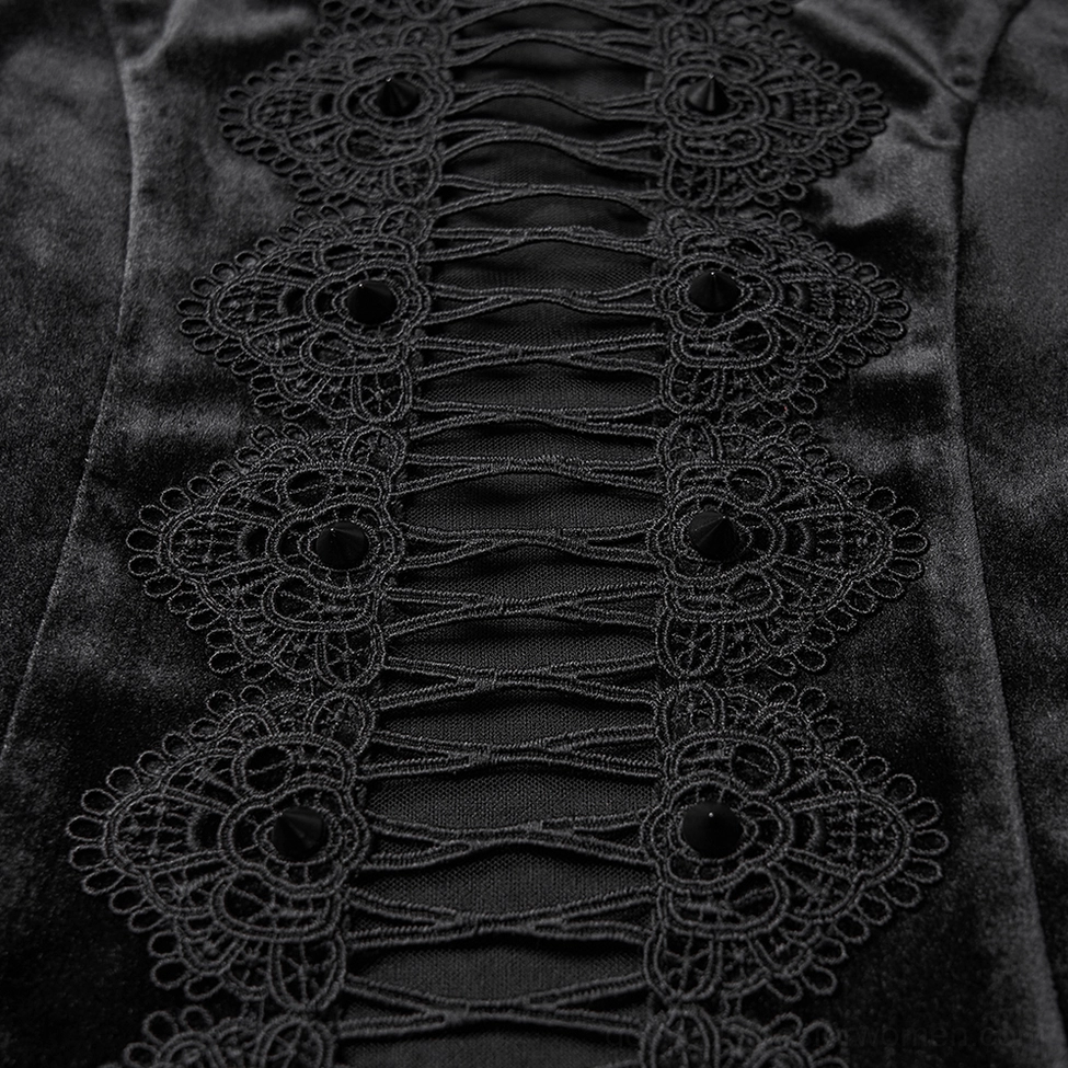 Close-up detail of embroidered lace hollow cutout panel on black gothic velvet top