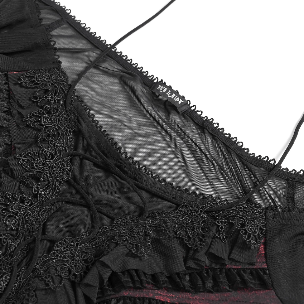 Close-up detail of black wine red gothic top showing lace trim ruffled mesh and internal brand label