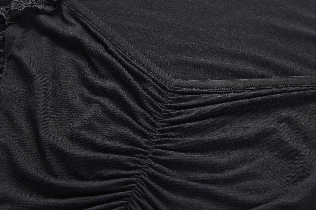 Close-up of ruched front bodice detailing on black gothic lace bell sleeve top