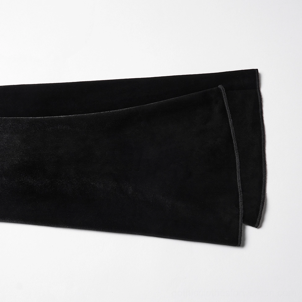 Detail shot of long velvet sleeve and fitted cuff design on black gothic top