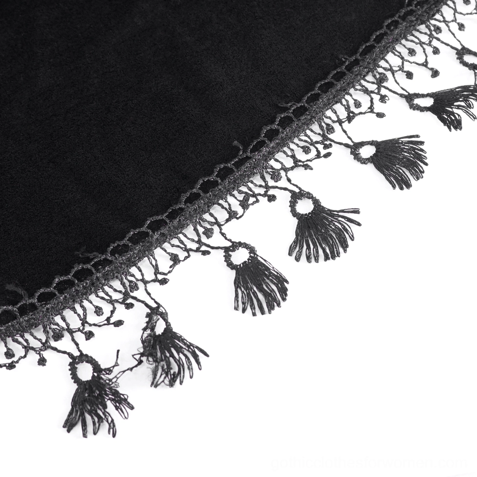 Close-up texture and construction of black velvet with burgundy lace embroidery on gothic top