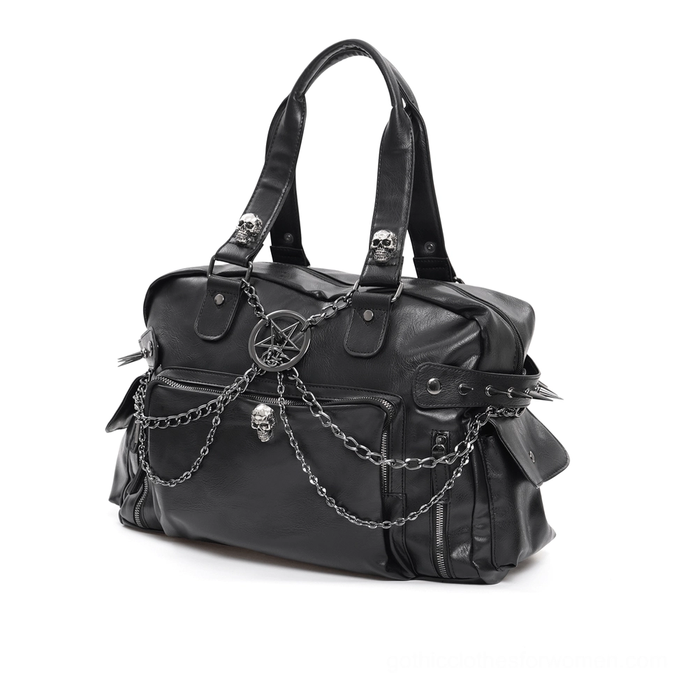 Front flat lay view of black gothic tote bag featuring pentagram charm, skull ornaments, and chain hardware details
