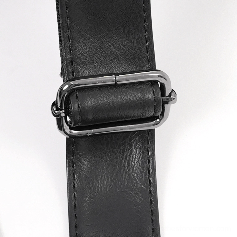 Close-up of gothic tote bag adjustable shoulder strap with metal adjuster buckle and stitched synthetic leather construction