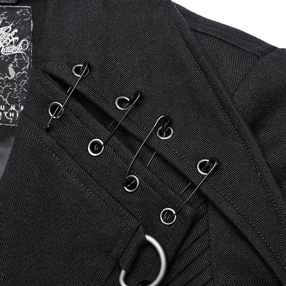 Close-up detail of black gothic trench coat collar fastener with safety pin clips and D-rings