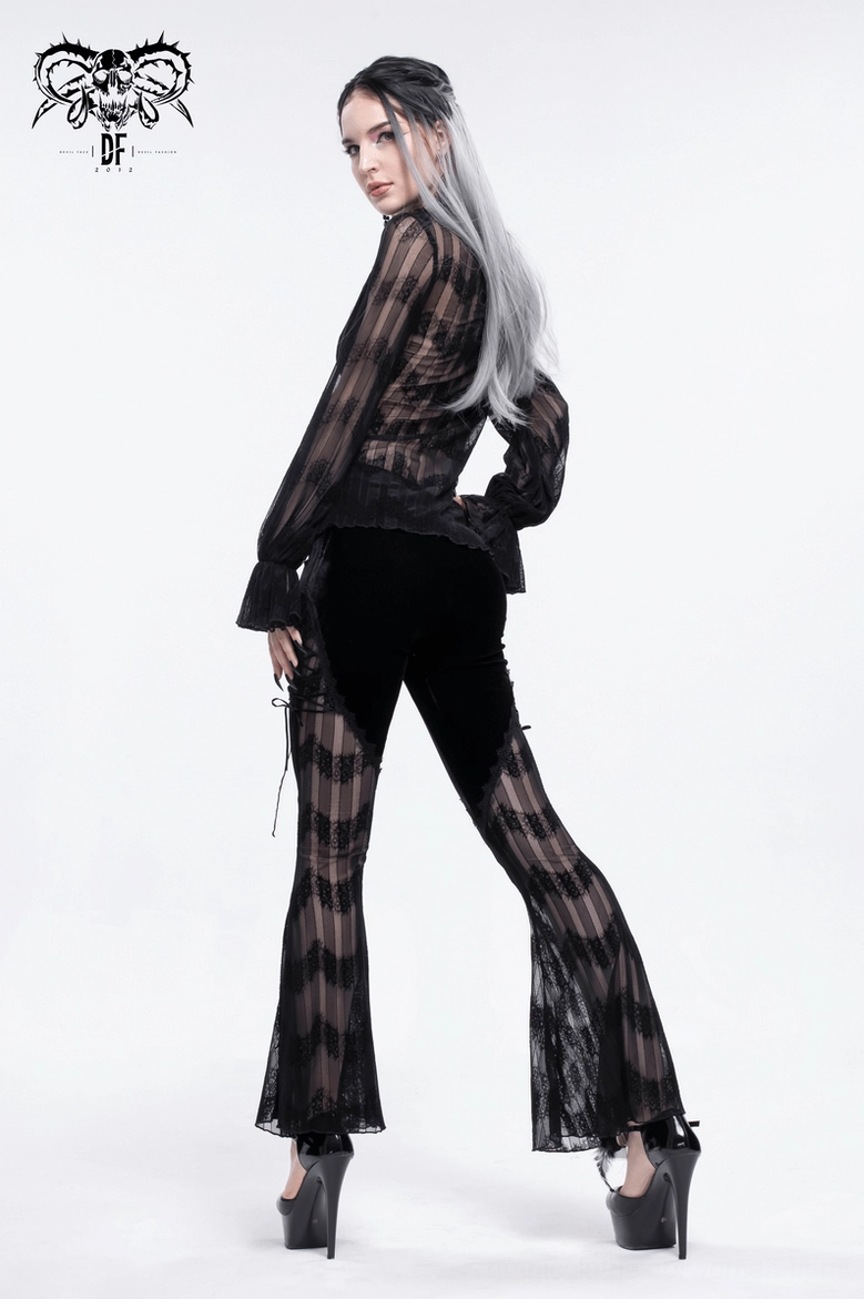 Black gothic trousers showing flared leg opening and mesh lace pattern from side angle