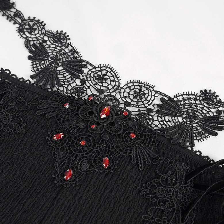 Close-up top view of lace-up gothic trousers showing intricate floral embroidery and red gem embellishments