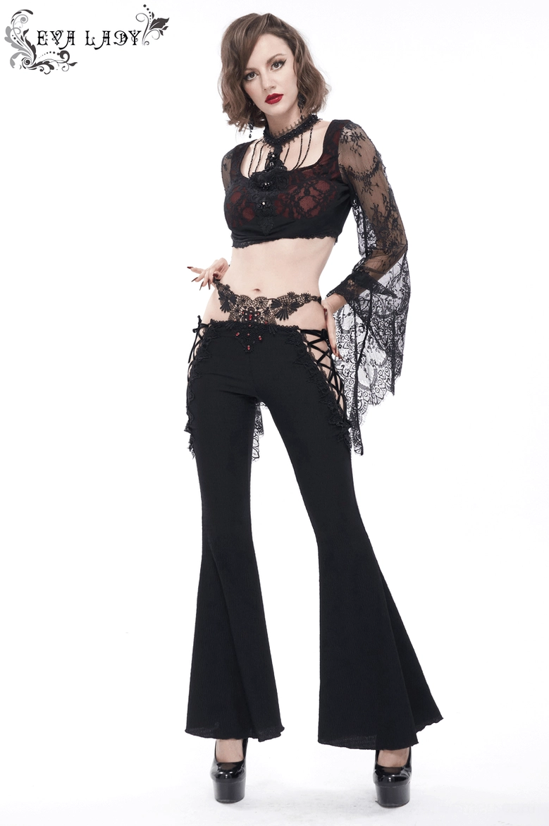Angled view of black gothic trousers emphasizing the lace-up side closure and flared silhouette