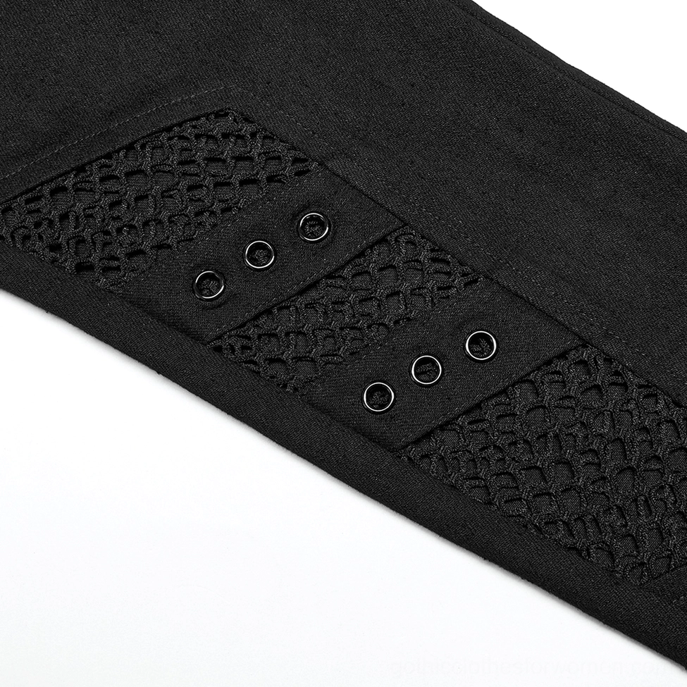 Close-up detail of black mesh fabric with metal eyelets and fishnet texture on gothic trousers