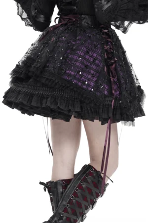 Back and side view of black-purple gothic tulle skirt showing side lace-up strap detail and purple plaid underlayer beneath sequin mesh