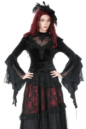 Black velvet gothic bell sleeve top with lace yoke, front view on model wearing red hair and black feather hat