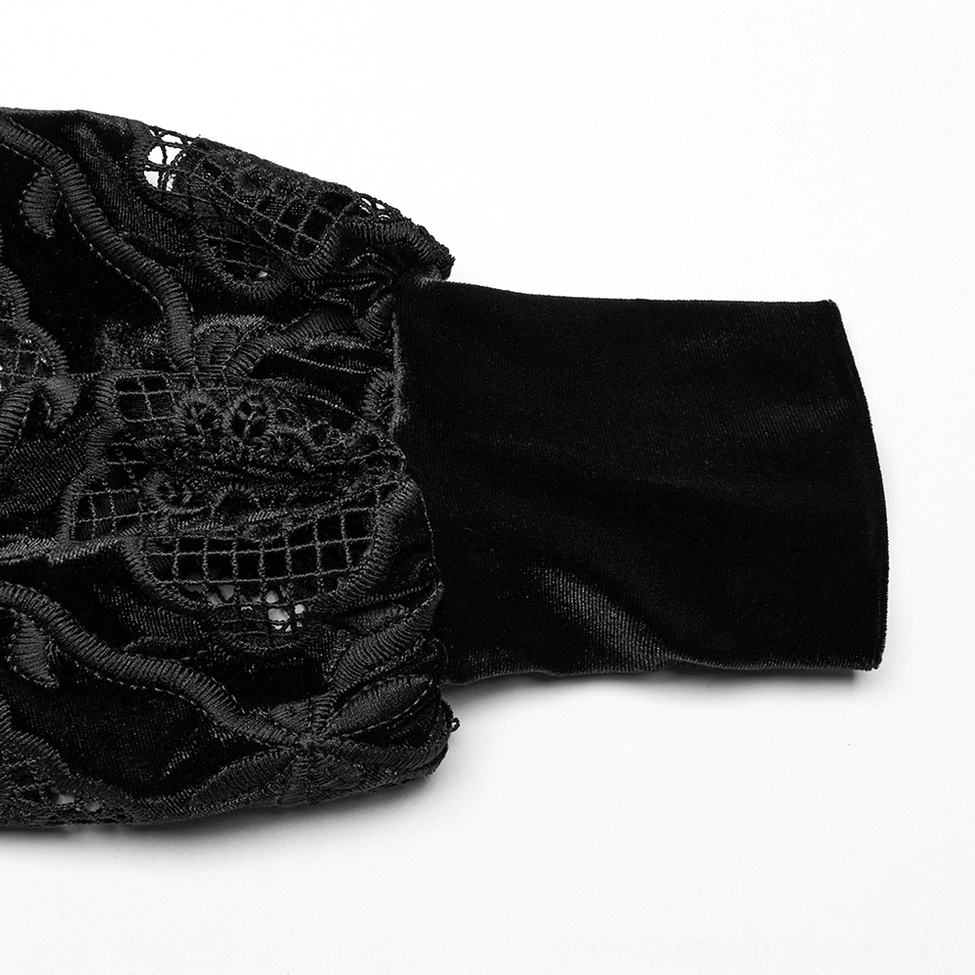 Close-up detail of black velvet gothic blouse cuff showing lace embroidery, velvet fabric texture, and elasticated cuff band