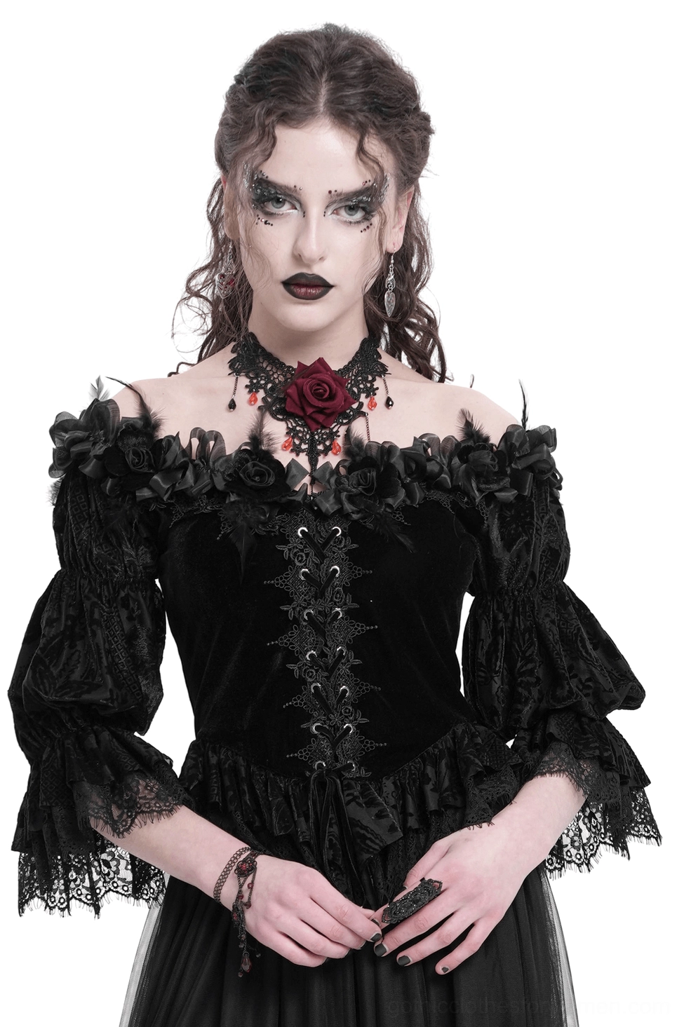 Gothic black velvet off-shoulder blouse with lace-up front, ruffled lace puff sleeves, and rose neckline details on model, front view