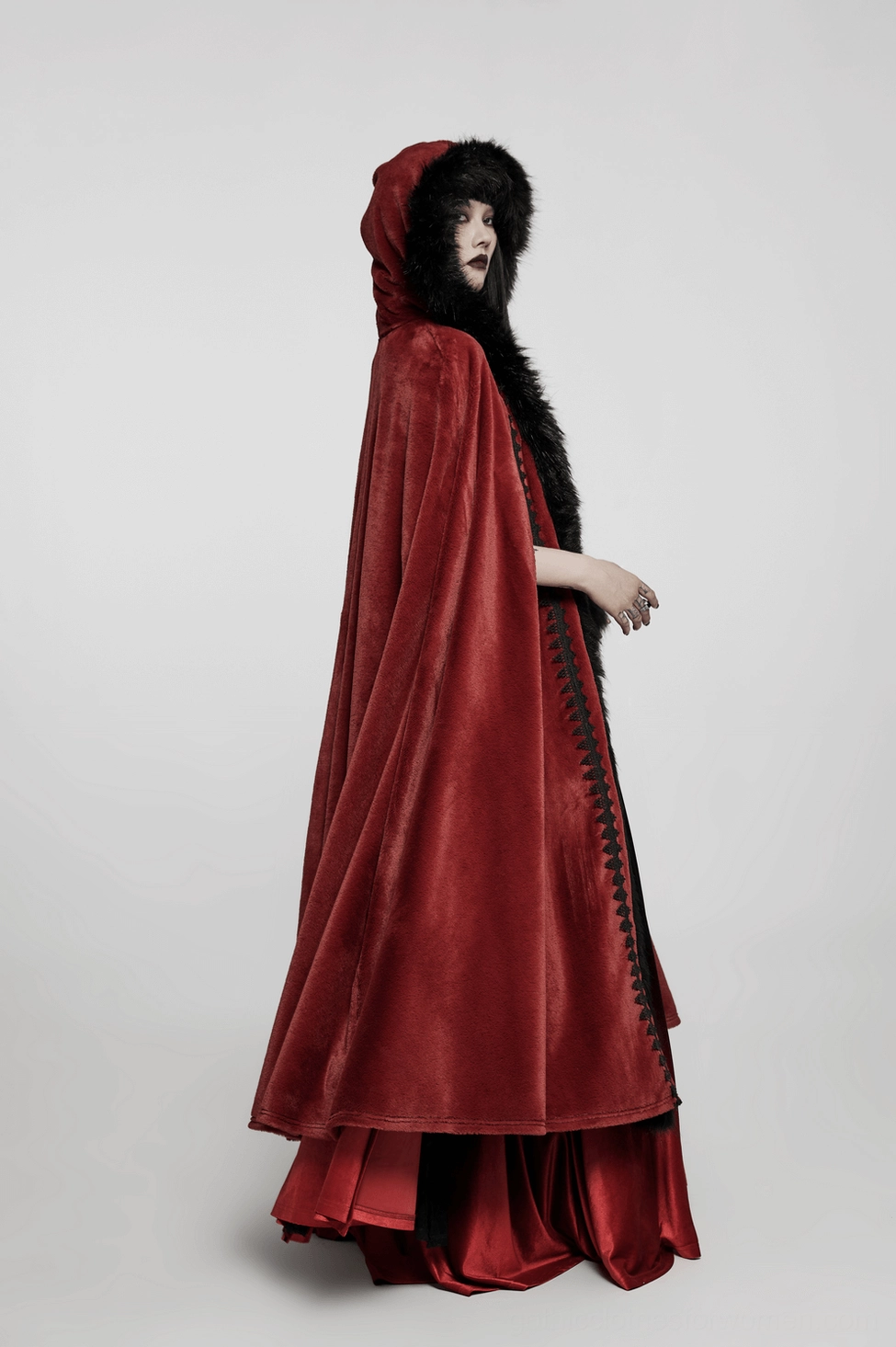 Red velvet gothic long cloak styled with black faux fur, dramatic silhouette and romantic aesthetic
