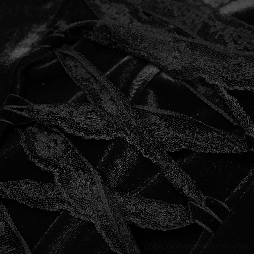 Close-up of black lace ribbon corset tie-up back detail on gothic velvet dress