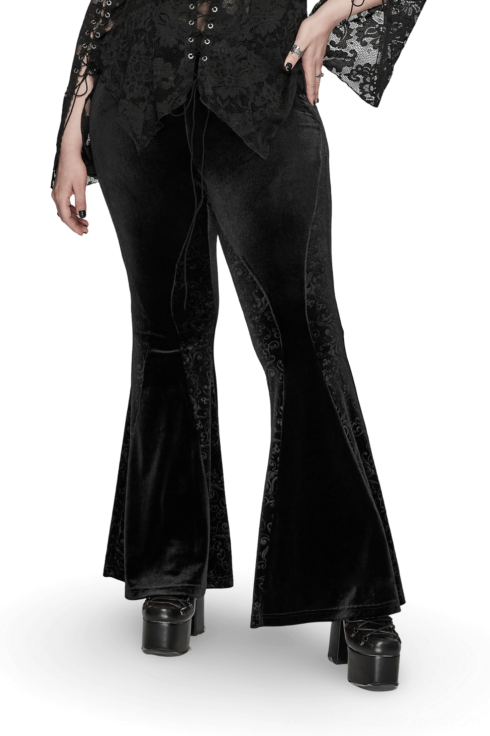 Black gothic velvet flared pants with baroque embossed side panels worn by model, three-quarter front view