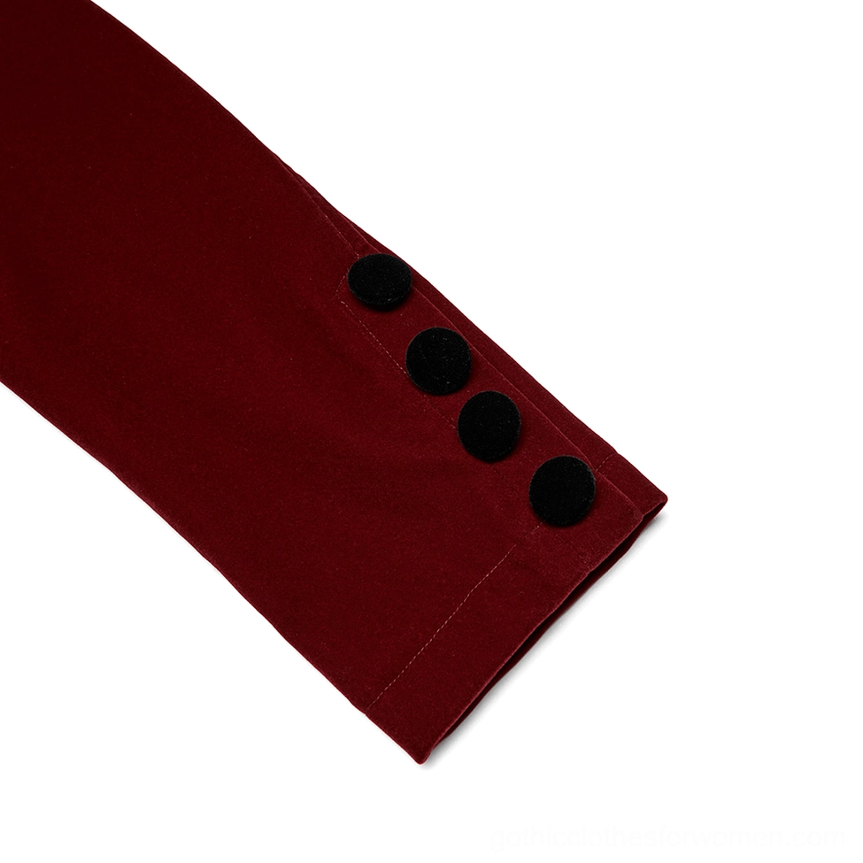 Close-up of wine red gothic jacket cuff detail showing velvet fabric texture and decorative button slit embellishment on sleeve
