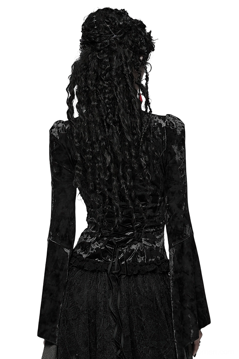 Back full-body view showing lace-up corset back closure and dramatic flared sleeves of gothic velvet lace top, model with dreadlocks