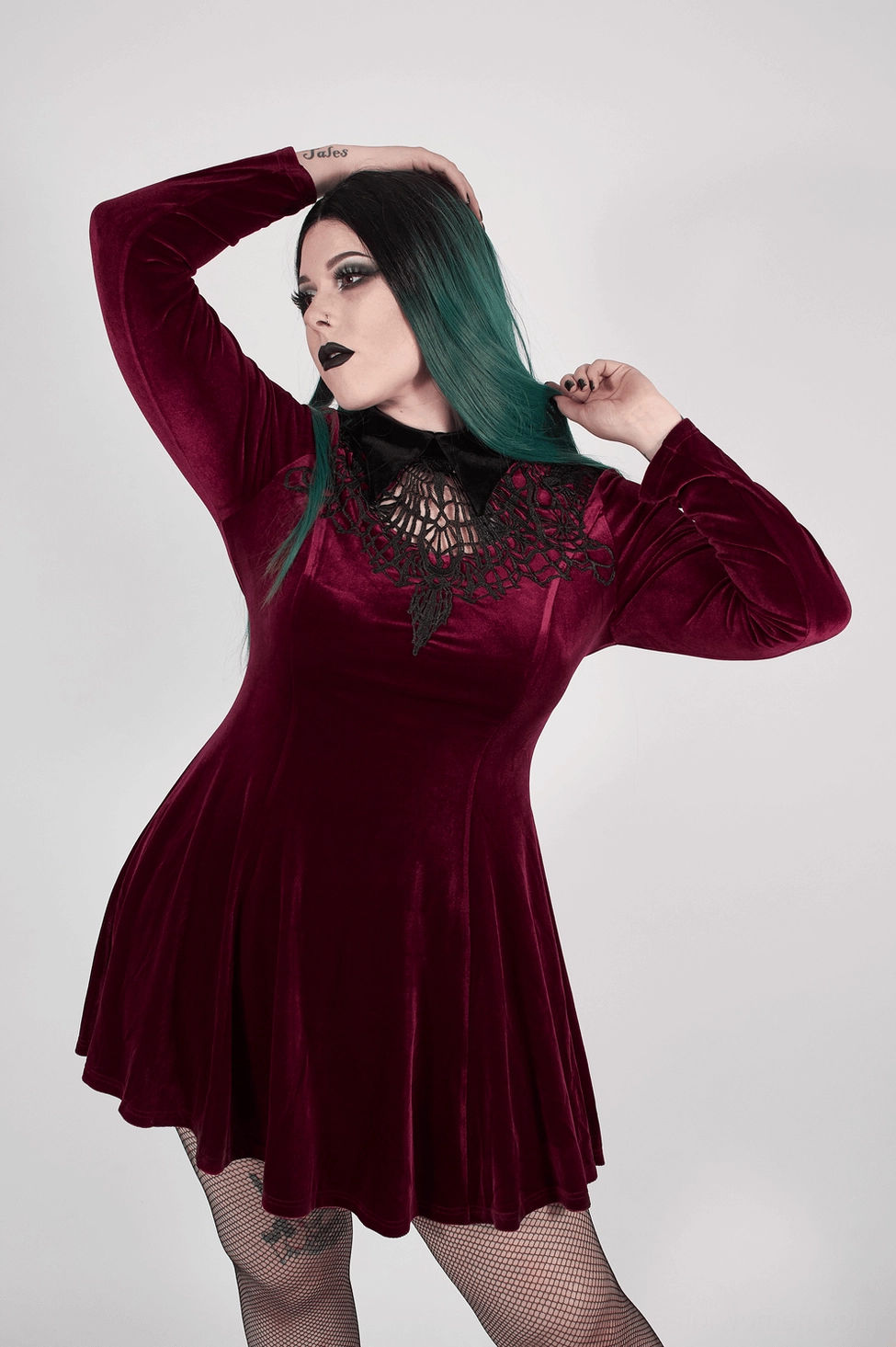 Wine red velvet gothic corset lace-up dress styled with accessories and dark aesthetic on model