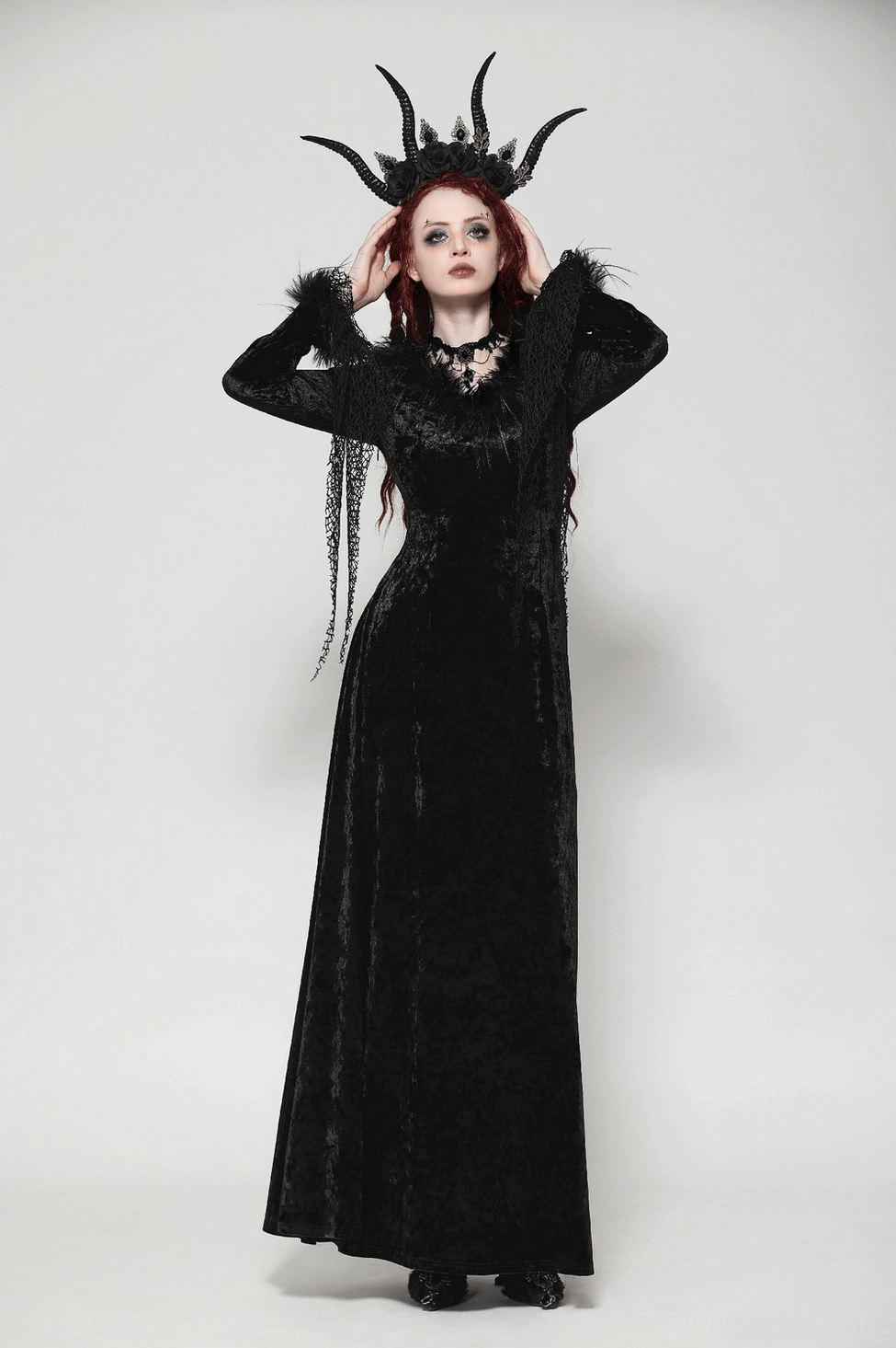 Black velvet gothic dress back detail showing lace-up corset, furry trim, and maxi skirt length