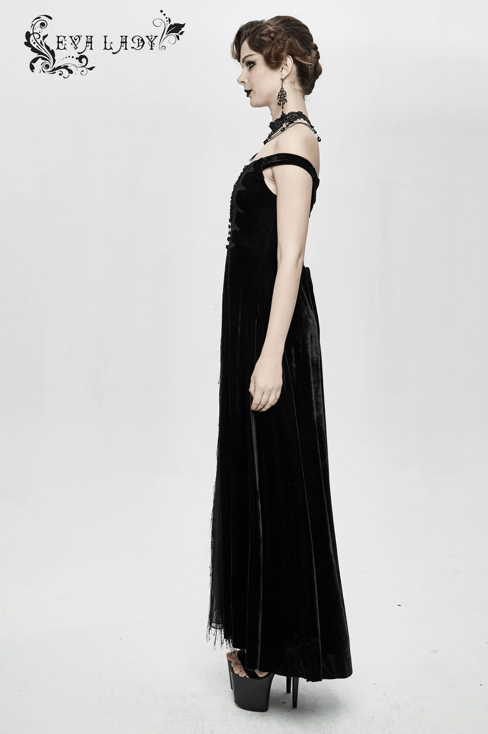 Black velvet gothic off-shoulder maxi dress with lace-up back closure, full-length back view on white studio background