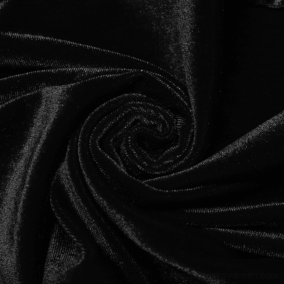 Black velvet gothic flared pants displaying elastic velvet quality and luxurious fabric sheen