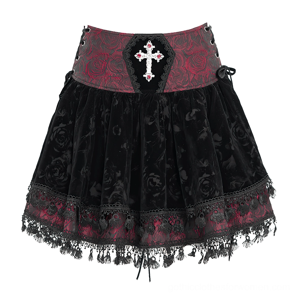 Flat lay front view of gothic velvet skirt showing rose jacquard waistband cross decoration and side tie details
