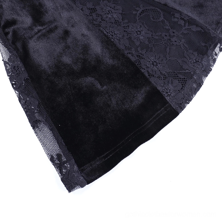 Gothic black velvet slip dress with lace neckline and cross embellishment on model, full length view