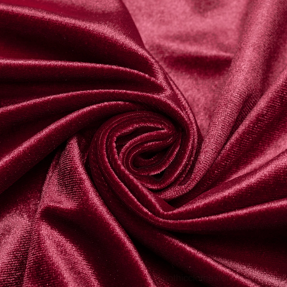 Burgundy velvet gothic long sleeve top styled with black leather skirt showing complete alternative fashion aesthetic