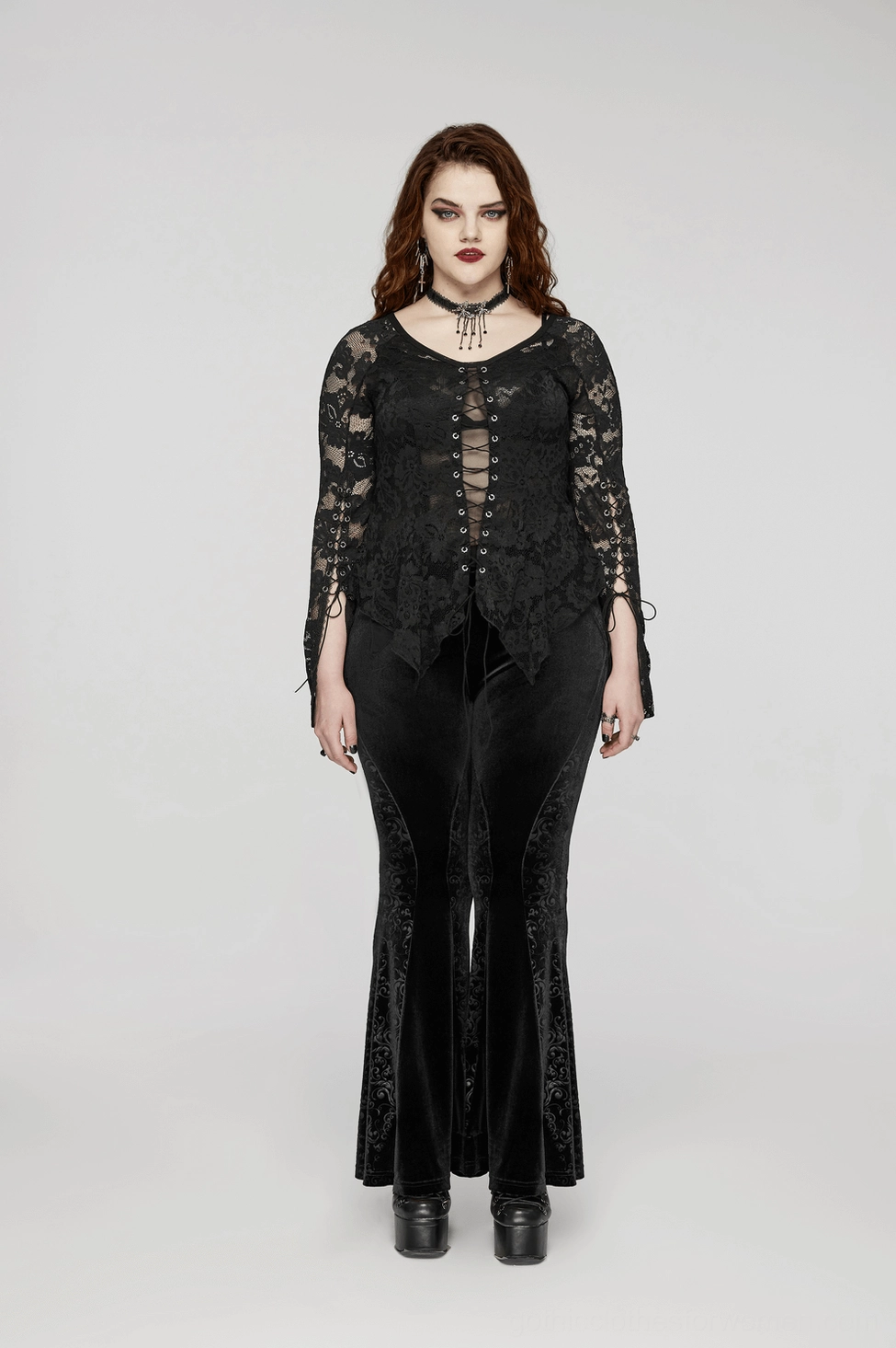 Black gothic velvet flared pants showing proportions and how embossed paneling creates dimensional texture