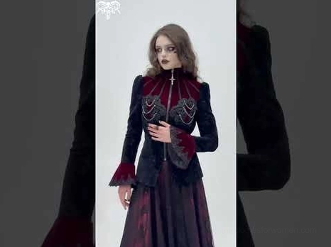 Medium front shot of gothic Victorian wine red blazer on model against gray background displaying fitted goth silhouette and architectural tailoring