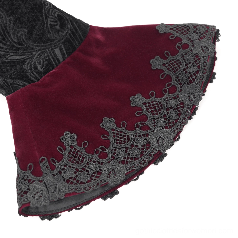 Close-up of gothic Victorian blazer cuff showing wine red velvet base with black lace trim and intricate jacquard patterned fabric