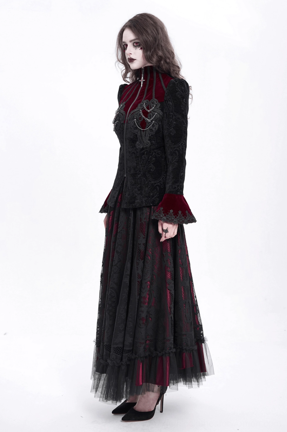 Three-quarter view of gothic Victorian wine red blazer displaying fitted silhouette, chain details, and bell sleeve proportions on model