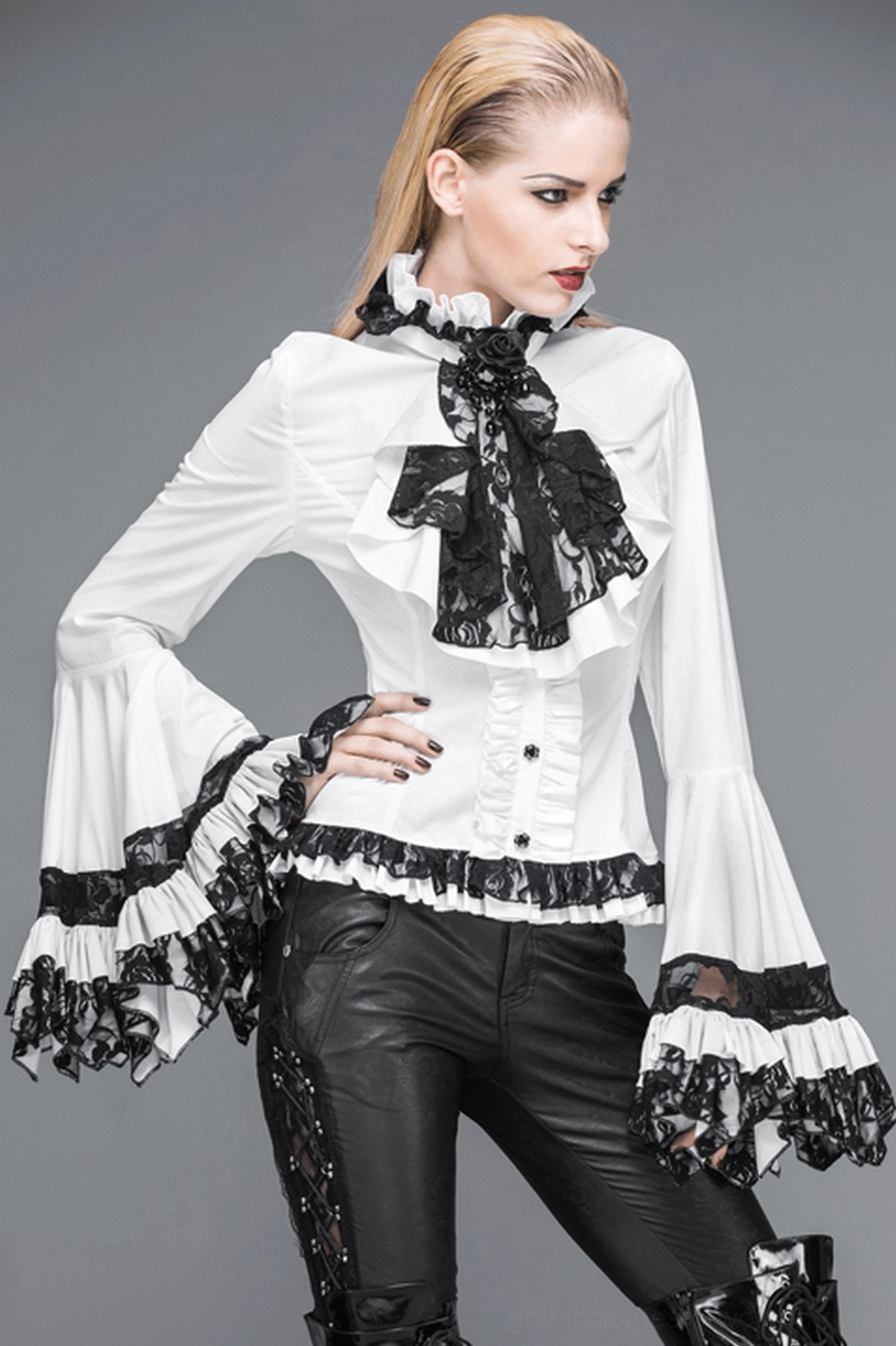 Side profile of gothic Victorian blouse on mannequin displaying fitted waist and voluminous sleeve architecture