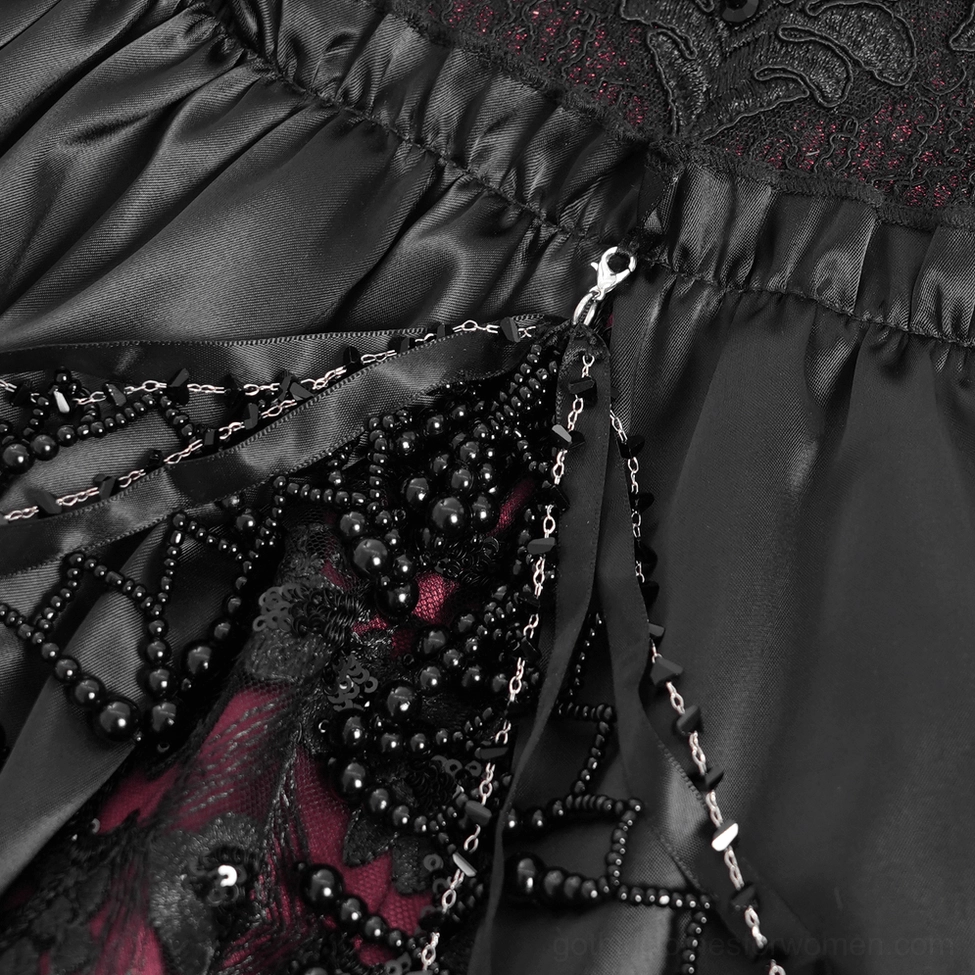 Side profile view of gothic Victorian evening gown showing ruffle sleeve design, off-shoulder neckline, and flowing satin skirt with color contrast