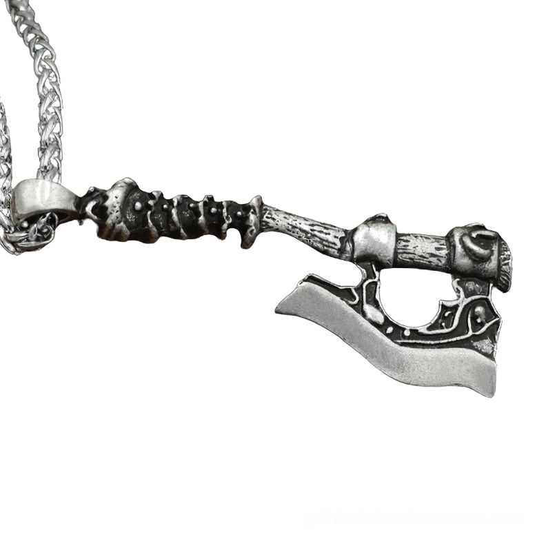Antique black Viking axe pendant with textured spiked handle design on decorative chain