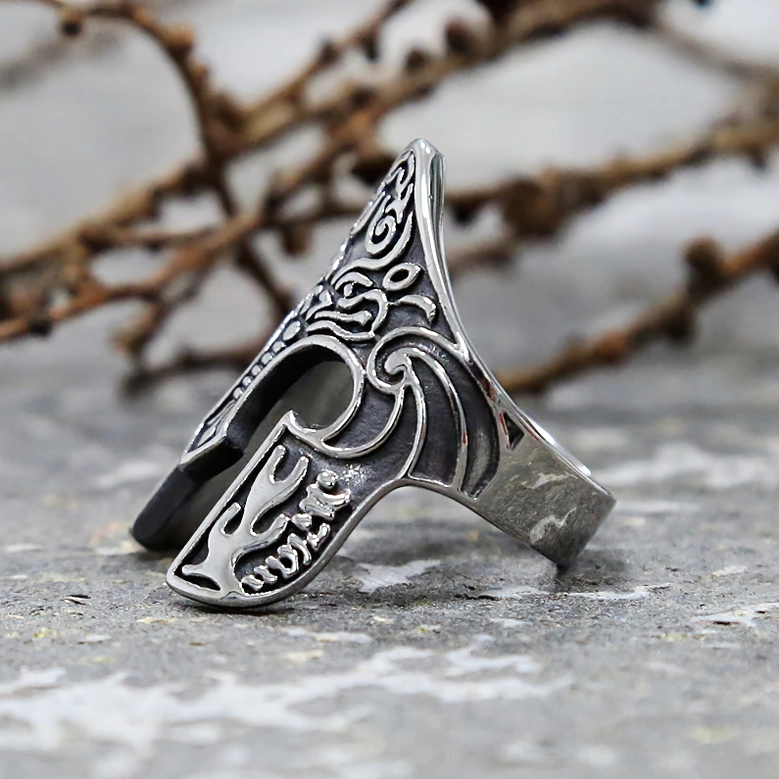 Viking warrior helmet gothic ring on stone surface low angle vintage metal finish