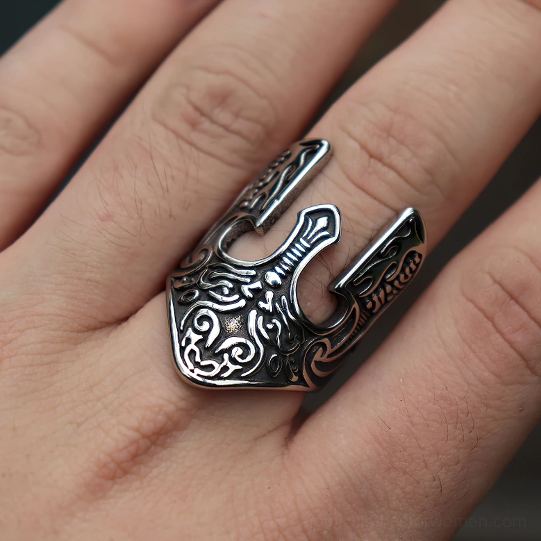 Viking warrior helmet ring worn on finger close-up side view engraved patterns