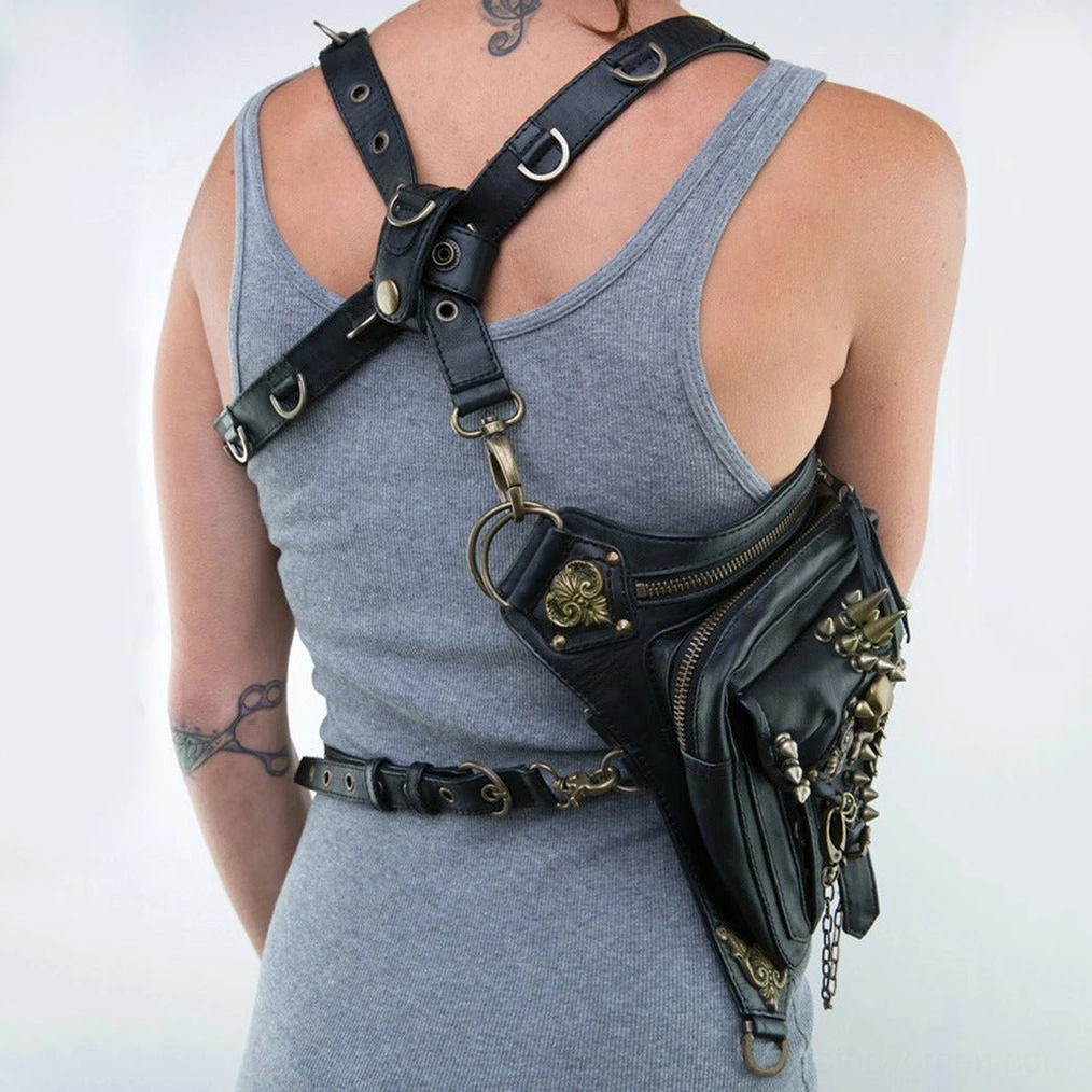 Back view of gothic waist bag worn as shoulder accessory with dual adjustable straps and waist belt attachment on female model