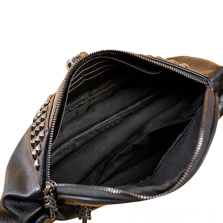 Interior view of black gothic waist bag showing fabric lining and inner zipper pocket organization