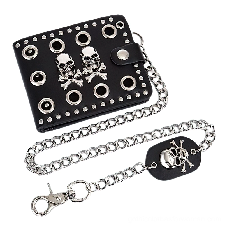 Black gothic bifold wallet hanging from silver metal chain with skull-shaped clasp charm