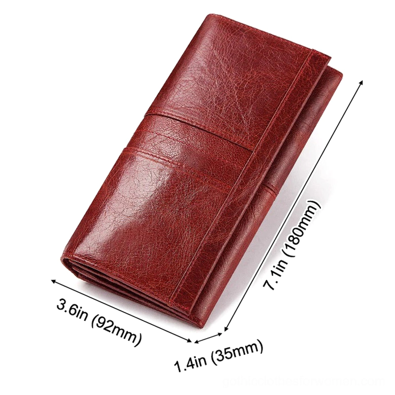 Long wallet clutch displaying cell phone pocket functionality and interior compartment organization for modern gothic lifestyle