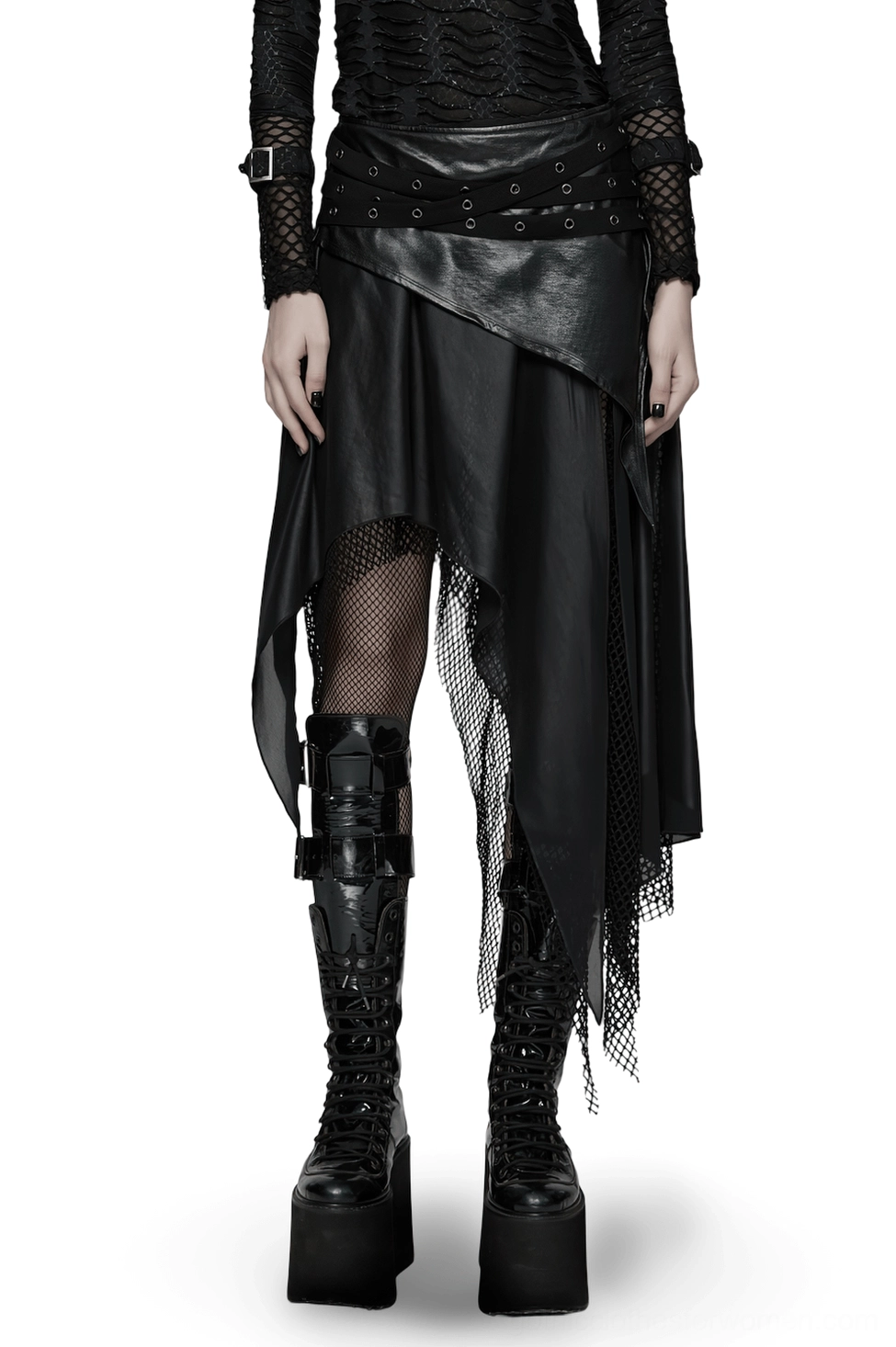 Black asymmetrical gothic wasteland skirt with faux leather and mesh panels worn by model on white background - front full-length view