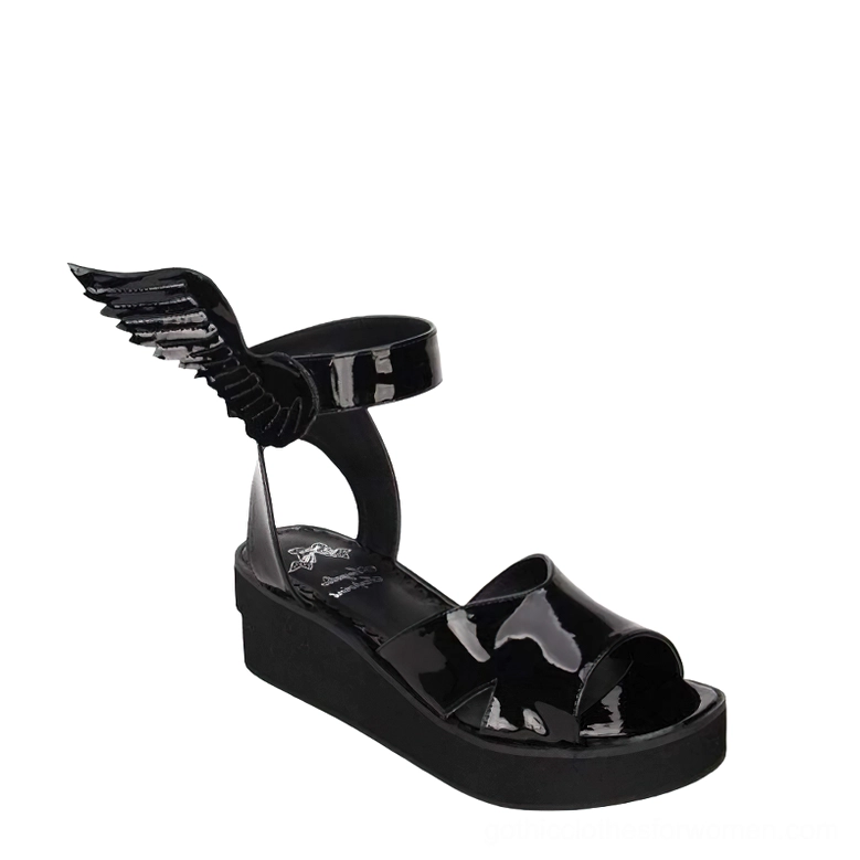 Black matte leather winged sandal three-quarter side-front angle showing open-toe platform design and wing embellishment details