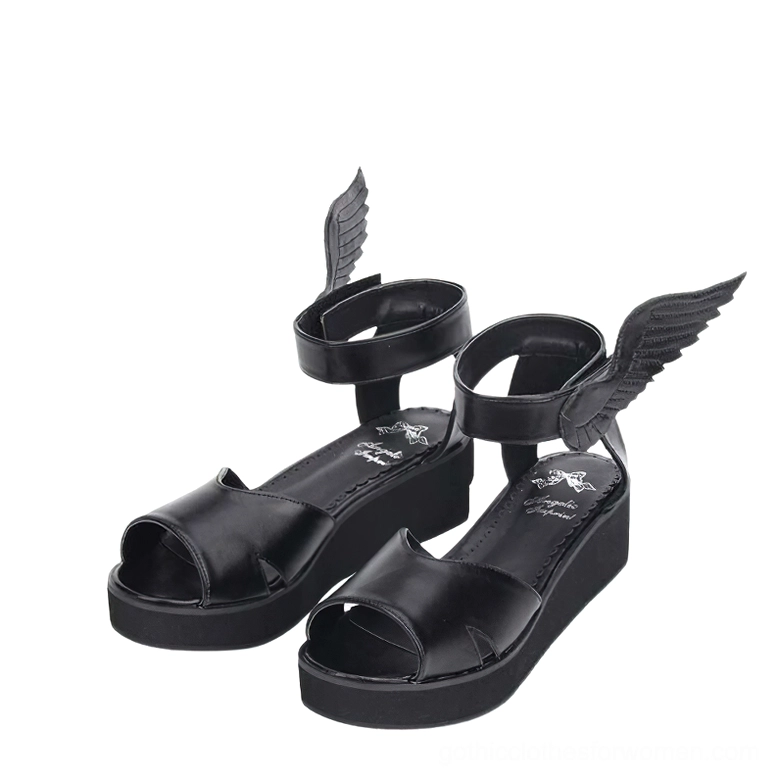 Paired black matte leather winged platform sandals front view with magic tape fasteners, open-toe configuration, and wing ankle embellishments