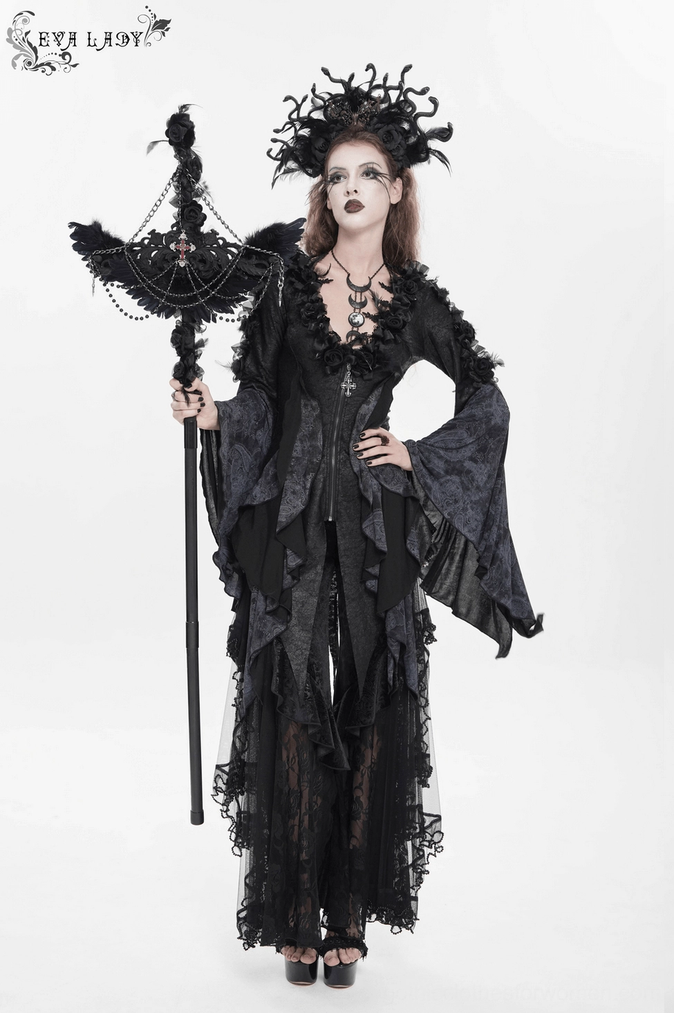 Gothic witch raven cross staff with dramatic feather presentation and ceremonial cross pendant