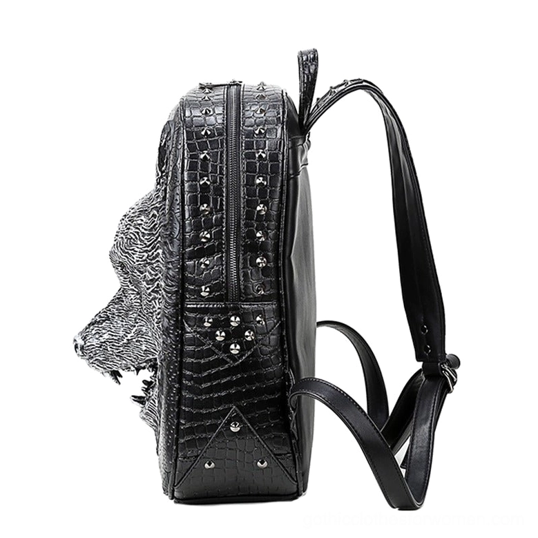Gothic wolf backpack side view showing studded shoulder strap, side zipper, and embossed wolf head design detail